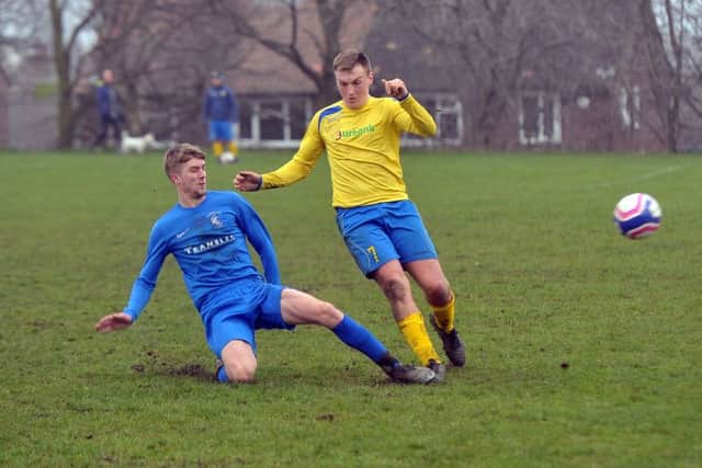 Woodcock's Danny Alcock tackles Rodley's Kurtis Hayes.  PIC: Tony Johnson