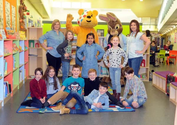 BLUE: Staff and the school council at Pudseys Waterloo Primay School sport their denim clothing. PIC: Tony Johnson