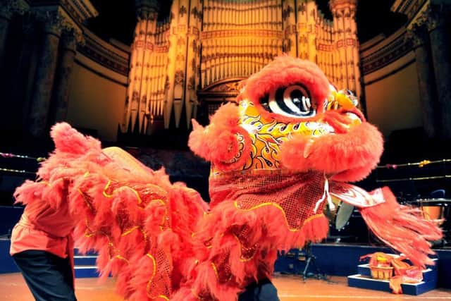 The traditional Lion Dance  on stage at Leeds Town Hall, part of the Leeds Chinese Community School  'Rhythm of Spring Chinese New Year' celebrations.