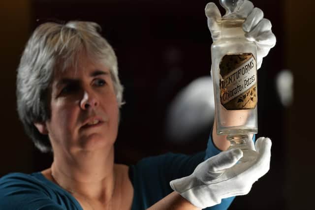 Danger Zone, a new exhibition which opens at Kirkstalls Abbey House Museum later this week, explores some of the surprising everyday threats that were hiding in plain sight in homes and workplaces over the past 150 years. 
Social History Curator Kitty Ross with a bottle of Lentiforms of Chlorate of Potass- pastilles used to soothe sore throats in the 1880s. Although supposedly beneficial, the sweets actually contained potassium chlorate which could spontaneously combust in the owners pocket. 
24 January 2019.  Picture Bruce Rollinson