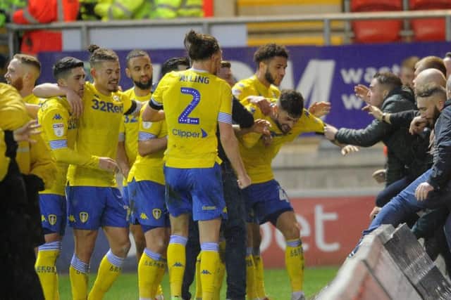 Leeds United's players celebrate Mateusz Klich's late winner at Rotherham.