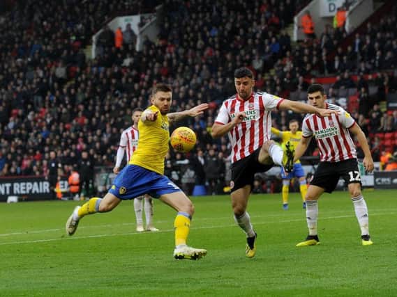 Stuart Dallas volleys at goal during Leeds United 1-0 win at Sheffield United on December 1. He was diagnosed with a fractured foot after the game.