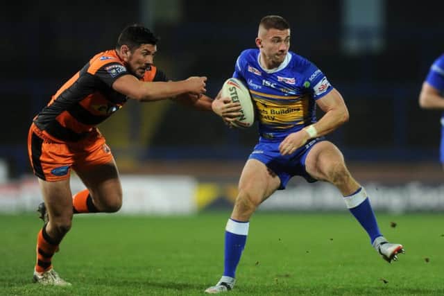 Leeds Rhinos'  Jack Walker gets away from Castleford's Chris Clarkson.  Picture Tony Johnson.