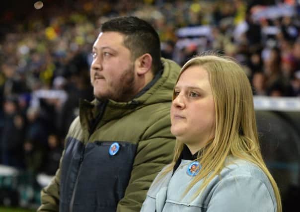 Toby Nye's parents Simon Nye and Stacey Worsley during the minute's applause.