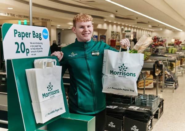 Pictures to show how Morrisons is giving customers the option of using large paper carrier bags in eight of its stores from this week. The trial is a response to customers who have told Morrisons reducing plastic is their number one environmental concern. The new US-style paper grocery bags have handles and are a similar capacity to standard plastic carrier bags.  They are 100% PEFC accredited meaning they are sourced from forests that are managed responsibly.  

Priced at 20p each the paper grocery bags, which can be reused and ultimately recycled, are labelled 'Reusable Paper Bag'. As part of the trial, Morrisons is also increasing the price of standard plastic carrier bags from 10p to 15p to further reduce plastic use. This follows Morrisonsâ¬" removal of the 5p carrier bags early in 2018 which led to 25% reduction in overall bag sales.  This 15p standard plastic carrier bag is produced in the UK and is made from recycled material reclaimed from Morrisons stores. 

For more information, please contact the
