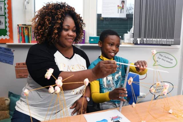 Number Day at Bracken Edge Primary School, where parents are invited in to join pupils taking part in maths activities. Clementina Ajetunmobi with her son Adrian.