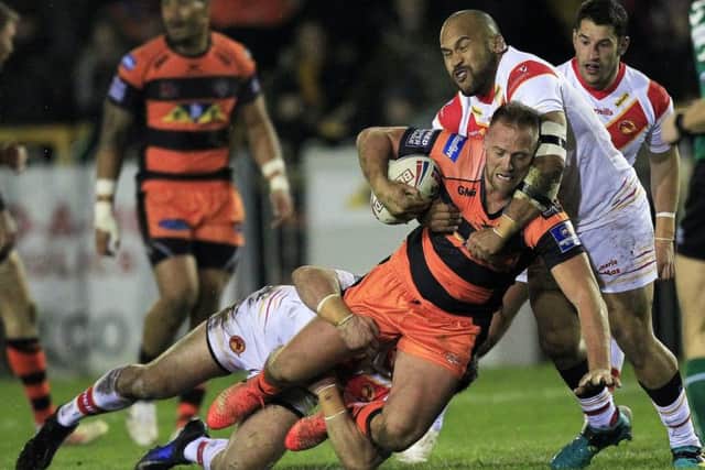 Liam Watts is tackled by Catalans Dragons' Mikael Simon and Sam Moa.