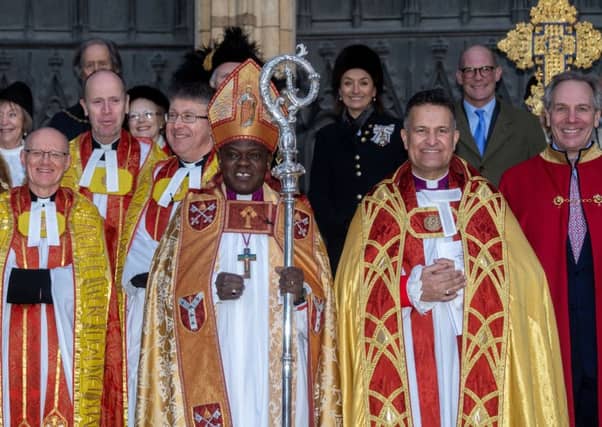 Archbishop of York, John Sentamu, next to The Dean of York The Right Reverend Dr Jonathan Frost, on the steps of York Minster after the service.