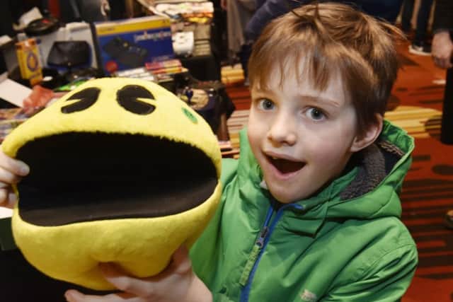 Isaac Morris, six, with a Pac-Man toy