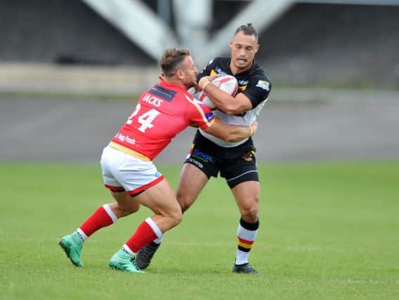 Dane Chisholm's drop-goal proved decisive as Bradford began the new season with  a narrow win over Featherstone.