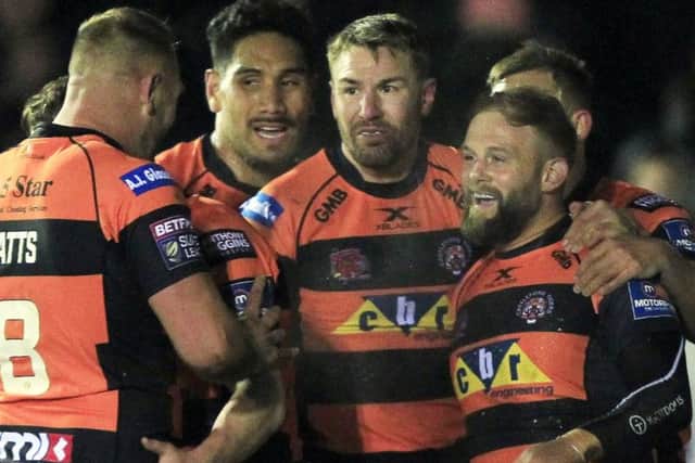 Paul McShane is congratulated by team-mates after scoring against Catalans Dragons on Friday.