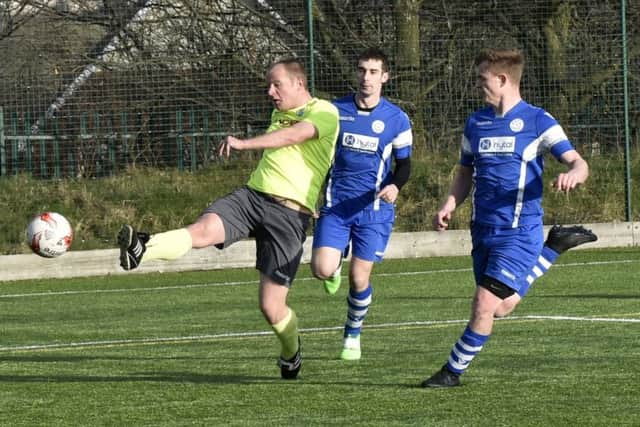 Matty Jackson shoots for Gildersome against Morley Town