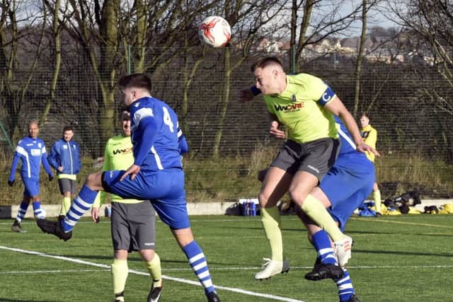 Adi McCormack heads wide for Gildersome against Morley Town.
