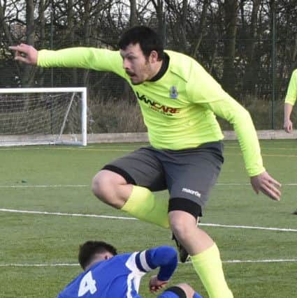 Ian Dawson of Gildersome Spurs OB goes past Rob Gumbley of Morley Town. Pictures: Steve Riding.