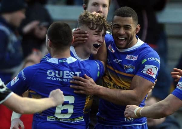 Harry Newman, centre, is congratulated by Kallum Watkins on his try against Castleford Tigers in pre-season.