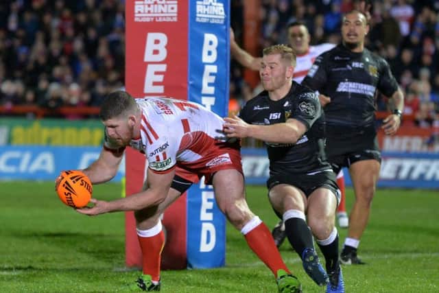 Former Rhino Mitch Garbutt scores Hull KR's second try against Hull FC.