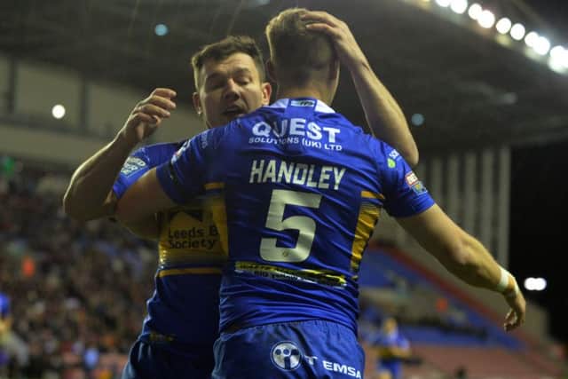 Ash Handley celebrates his opening try against Wigan with Brett Ferres.