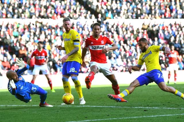 Kemar Roofe forces Middlesbrough's Darren Randolph into a save.