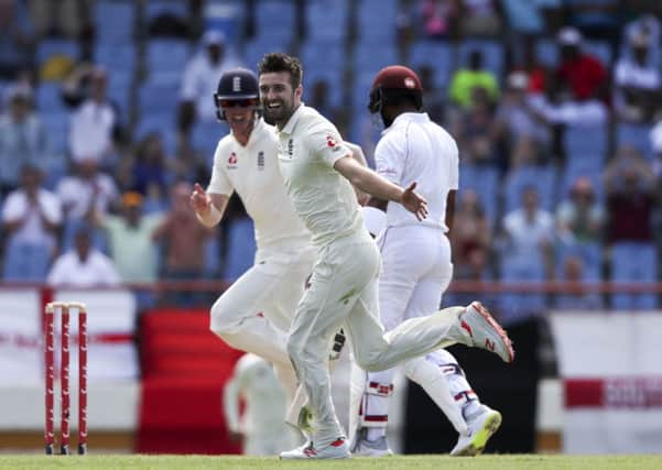 England's Mark Wood celebrates taking the wicket of West Indies' Shai Hope in St. Lucia. Picture: AP/Ricardo Mazalan