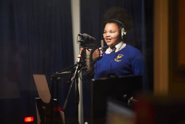 A student from Cockburn John Charles Academy in Leeds in the studio recording LNERâ¬"s Track Record, a unique audio journey created to celebrate the people along LNERâ¬"s east coast route, and their diverse accents.