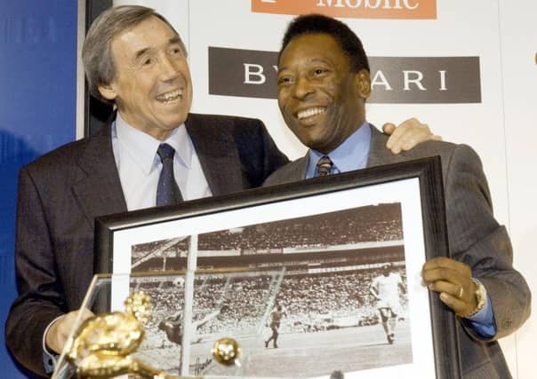 Gordon Banks with a picture of his famous save from Brazil striker Pele. PIC: PA