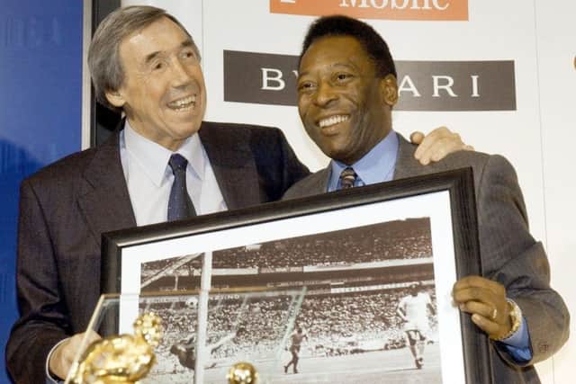 Gordon Banks with a picture of his famous save from Brazil striker Pele. PIC: PA