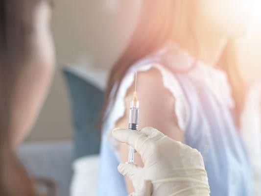 In England, girls aged 12 to 13 years are routinely offered the first HPV vaccination when they are in school year 8