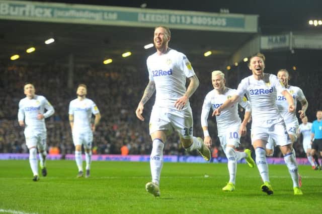 Pontus Jansson is mobbed by his team-mates at Elland Road.