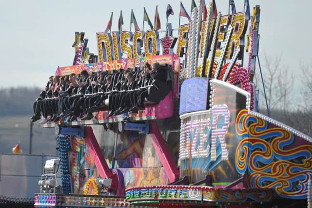 14 February  2019   ......  Children enjoy the rides at the opening of the great Leeds Valentines Fair at Elland Road. Picture Tony Johnson.