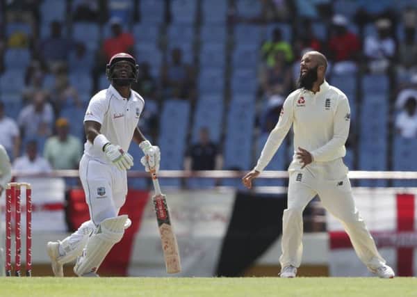 England's Moeen Ali celebrates taking the wicket of West Indies' captain Kraigg Brathwaite on the recent tour.