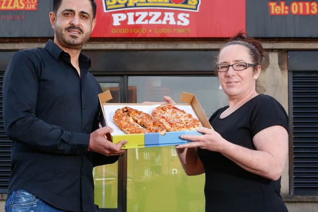 Mr Hussain and Jane Harvey jointly presenting the calzones