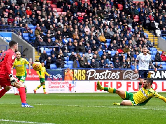 BOOSTED: Norwich City's Emi Buendia scores his side's third goal of the game during Saturday's 4-0 win at Bolton Wanderers.