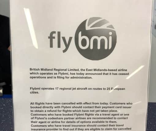 A notice at Bristol Airport informing passengers that flybmi flights have been cancelled following the collapse of the airline. Photo: PA Wire