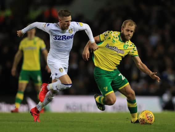 UP TOGETHER?: Leeds United's Barry Douglas and Norwich City's Teemu Pukki lock horns in this month's clash at Elland Road. The two sides have the best run-ins of the top seven on paper and will occupy the top two positions if Leeds win their game in hand.