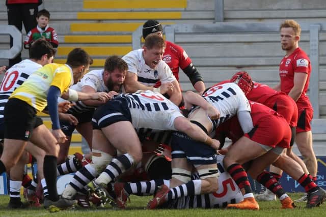 OVER THE LINE: Matt Smith (partly hidden) goes over for a Carnegie try against Jersey reds, but it was to prove a frustrating afternoon at Headingley for the hosts. Picture: Andrew Varley.