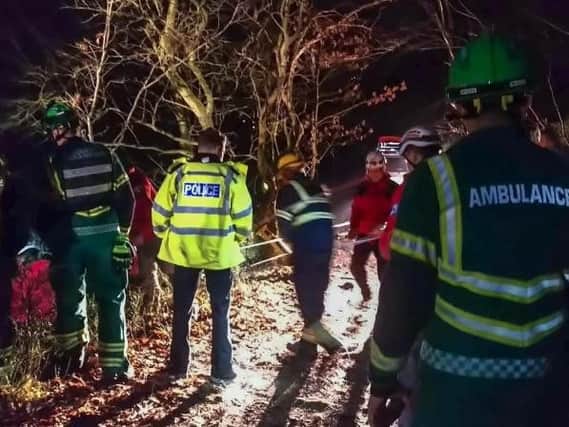 Calder Valley Search and Rescue Team shared this image of its volunteers working alongside emergency services at the scene.
