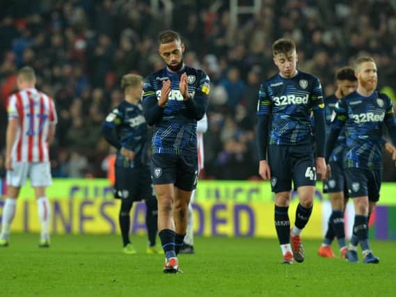 Kemar Roofe walks from the field after Leeds United's defeat at Stoke City last month. The striker is facing a spell out with a knee injury.