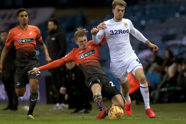 Swansea City's George Byers (left) tackles Leeds United's Patrick Bamford during the Sky Bet Championship match at Elland Road, Leeds. Photo by Mike Egerton/PA Wire.