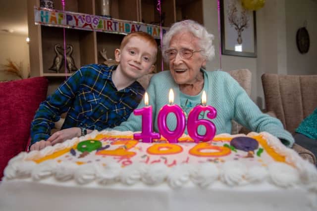 Monica Budge, who lives at at her retirement community at Assisi Place in Hunslet, Leeds, celebrating her 106th birthday with her great grandson Samuel Barrett, aged eight, of Garforth. Picture by James Hardisty.