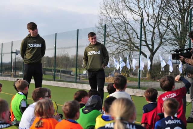 Leeds United's Leif Davis (L) and Robbie Gotts (R) at the club's foundation soccer school.