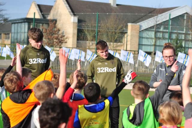 Leeds United's Leif Davis (L) and Robbie Gotts (R) at one of the club's foundation soccer schools.