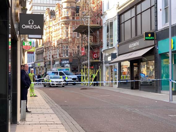 Commercial Street cordoned off after the manhole cover exploded. Photo: Charlottle Lacy.