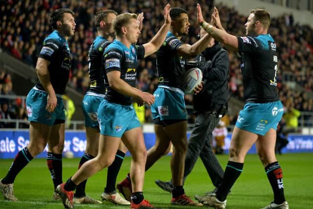 Leeds Rhinos players celebrates Kallum Watkins' try.