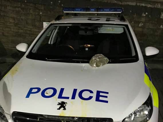 Vandals attacked the police car in Great Horton Road, Bradford.