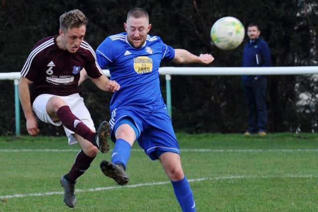Joe Kenny shoots for Carlton challenged by Nick Gledhill of Headingley. PIC: Steve Riding