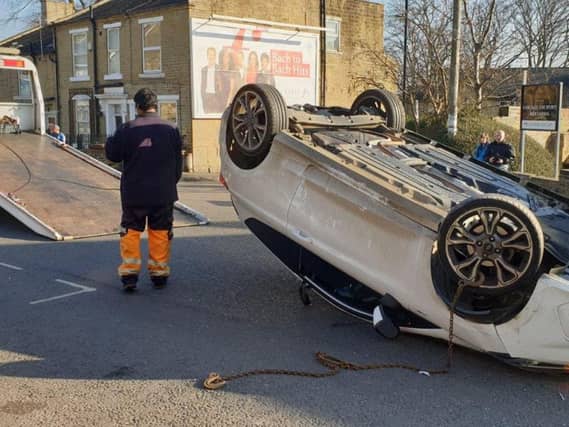 Overturned car in Chapeltown in Pudsey. Photo credit: West Yorkshire Police