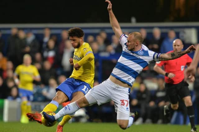 Leeds United's Tyler Roberts battles for the ball at Loftus Road against QPR.