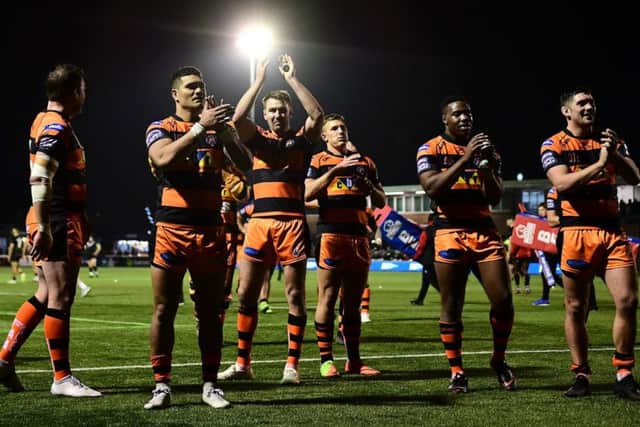 Castleford Tigers celebrate after their 40-6 victory at London Broncos.