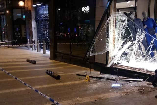 The aftermath of the attack on the Hugo Boss store