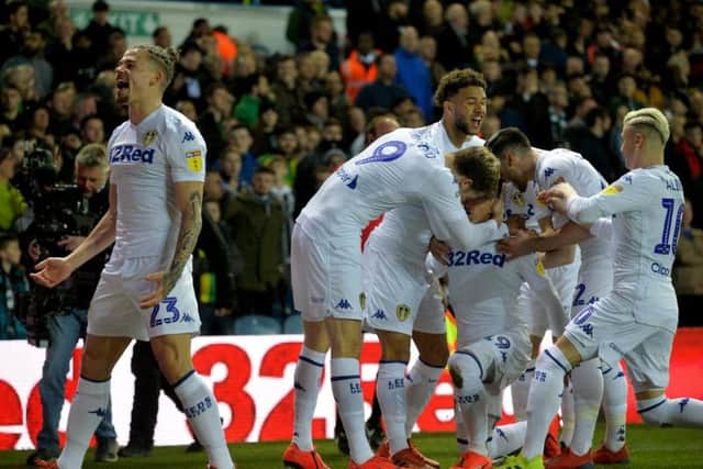 Leeds United's players celebrate after Pablo Hernandez's opener.